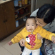 Qiu with her daughter (who has a duck leg in her mouth).